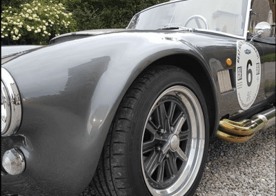 Close up of the front wheel arch of a Cobra replica